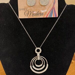 Cubic zirconia pendant on a gold tone chain and matching earrings 15”